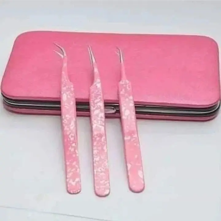 Three pink curved precision tweezers with decorative handles and a pink storage case on a white background